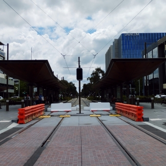 Trackworks, Alinga St, Civic, Canberra, with two tram lines and a station in between a busy street