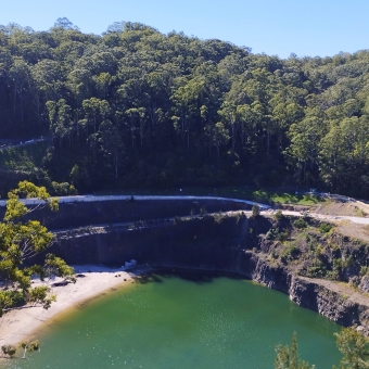 Perusing The Quarry Pool, Hornsby Park, Hornsby, with trees on the other bank encircling a large hole in the ground which has partially filled with water